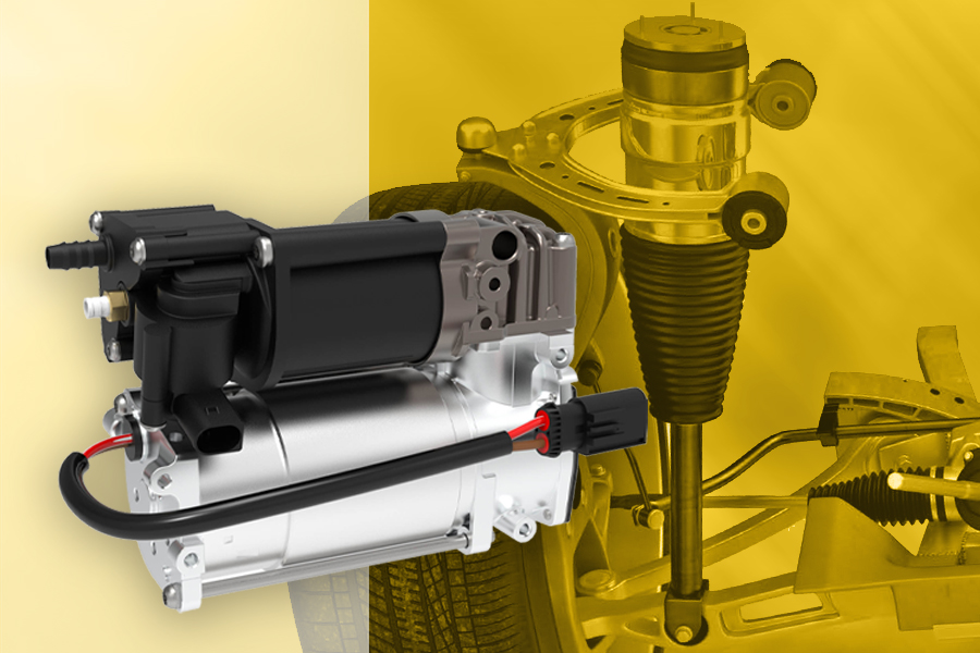 Compresor para suspensiones neumáticas de Magneti Marelli Parts & Services en primer plano, con rueda, eje y sistema de suspensión neumática en el fondo para contextualizar la aplicación del componente.